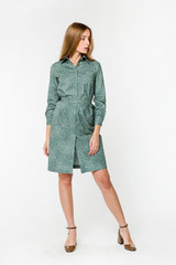 Young elegant female in light summer dress, over white background