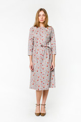 Young elegant female in light summer dress, over white background