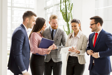 Group of businesspeople standing in the modern office