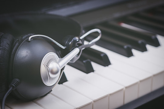 headphone on piano keys