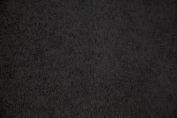 Background of building finishing cement with sand of black color, horizontal shot.