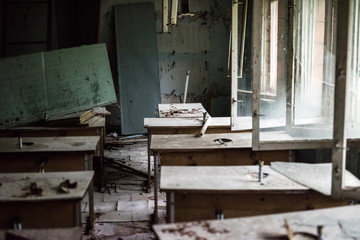 abandoned class room with dust and debris in abandoned school of Pripyat, Chernobyl, Ukraine
