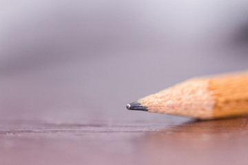 Tip of black pencil in close up