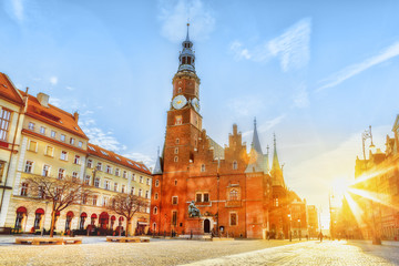 Fototapeta na wymiar Wroclaw city, Poland. Central square of old town with cathedral. Sunrise scenery.