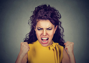 portrait of young angry woman screaming