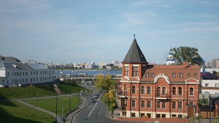 Naklejka premium Summer city landscape with a river and a beautiful old house. Kazan, Russia