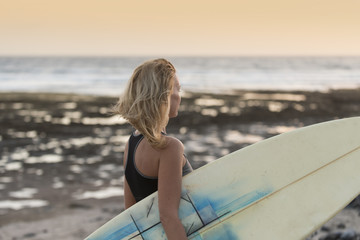 Beautiful woman with the surfboard