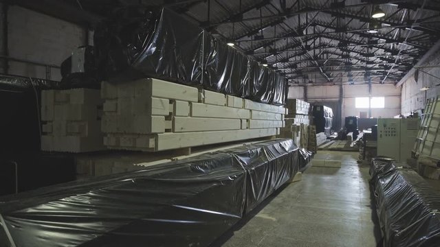 LVL glued Lumbe. Engineered stress rating product made by bonding together separate pieces of wood, having a nominal thickness of 2 inches or less. Neatly glued beam is in the manufacturing workshop.