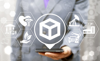 Logistics concept. Man offers smartphone with location cube icon on virtual screen. Global...