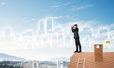 Businessman standing on roof and looking in binoculars. Mixed media