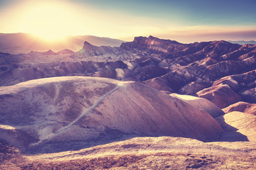 Vintage stylized sunset over Zabriskie Point, Death Valley National Park, USA.