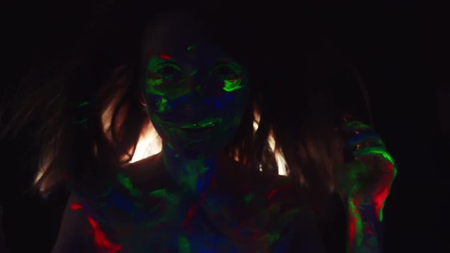 4K Disco Glow Neon UV Make-up Woman Dancing in Wind
