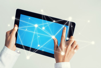 Close of female doctor hands working with tablet pc computer