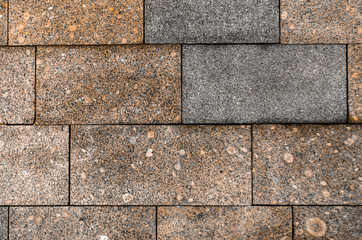 Wall texture bricks blocks of brown and dark granite