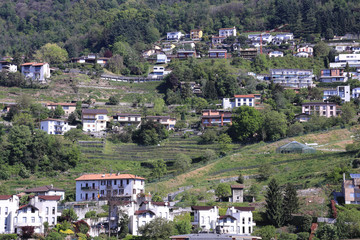 Fototapeta premium village with traditional stone houses scattered on the mountain side,