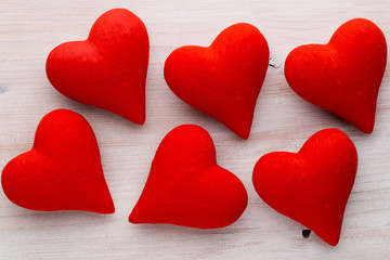 Red hearts the gray background. Valentine Day background.