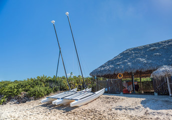 Sailing catamaran on the sandy beach