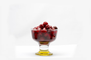 Cherry juice in glass and carafe