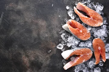 Foto auf Alu-Dibond Steaks of raw salmon on ice.Top view with space for text. © lilechka75