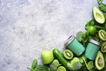 Green detox smoothie with ingredients for making.Top view with space for text.