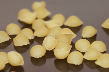 Macaroni scattered and isolated on a black background
