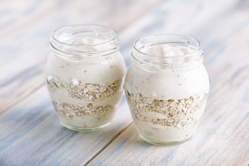 Yoghurt on a wooden light background