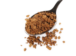 Pile of instant coffee grains and metal spoon isolated on white