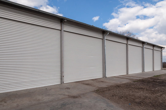 Storage units with roller shutter doors in industrial area