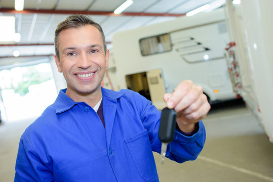 mechanic holding a key