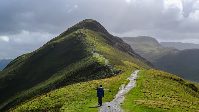 Hiking trail in the mountain landscape of Catbells hill top in Lake District, England