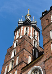 Fototapeta na wymiar St. Mary Church towers in Market square in Krakow in Poland