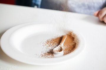 White Ceramic Spoon On A White Plate