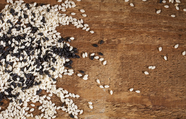 Background of fresh black and white sesame seeds