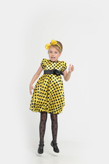 A little girl dressed in the style of the 60s