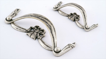 Fototapeta premium fittings for furniture. Handles for cabinets on a white background 