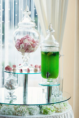 green healthy drink. sweets at the background