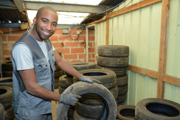 Worker holding tyre