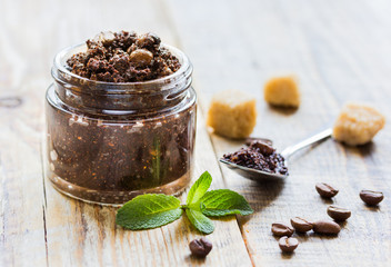 Organic spa with coffee scrub in cosmetic set on table
