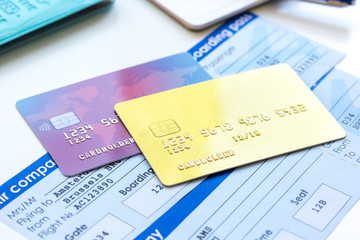 Credit cards with airline tickets for vacations on table background