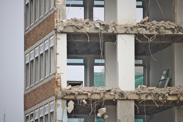Demolished office building with missing walls