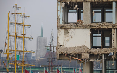 Demolished office building with sailing ship