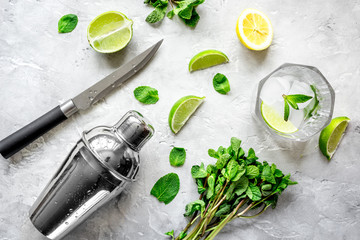making mojito on stone background top view