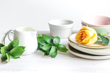 ceramic tableware with flowers on white background