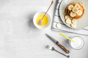 cooked pancake on plate top view at wooden background