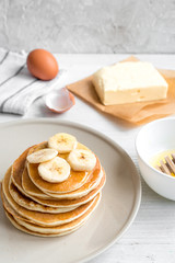 cooked pancake on plate at wooden background