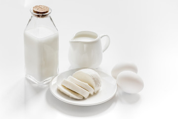 Fresh dairy products on white desk background