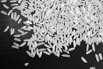 Hill rice grains on a black background, close-up