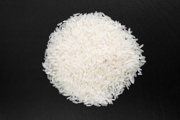 Hill rice grains on a black background, close-up