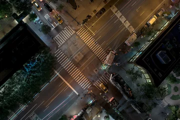 Fotobehang Overhead city corner by night © bartsadowski