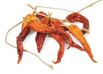 Dried beans of red pepper on white background
